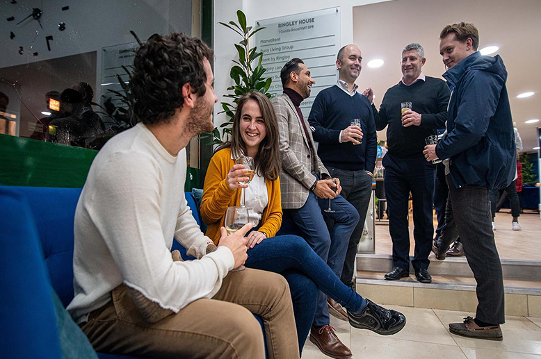 Members socializing in coworking space